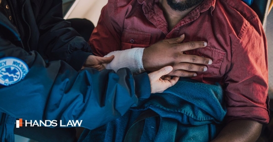 Injured man being helped by an EMT